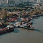 Aerial shot of Istanbul waterfront showing ships docked along a lush green shoreline. — Boosting Sales with a US Digital Mark