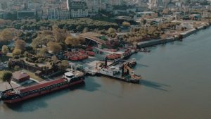 Aerial shot of Istanbul waterfront showing ships docked along a lush green shoreline. — Boosting Sales with a US Digital Mark