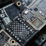 Detailed macro shot of electronic microchip components on a circuit board. — Electronic Stores Versus Retail Electronics