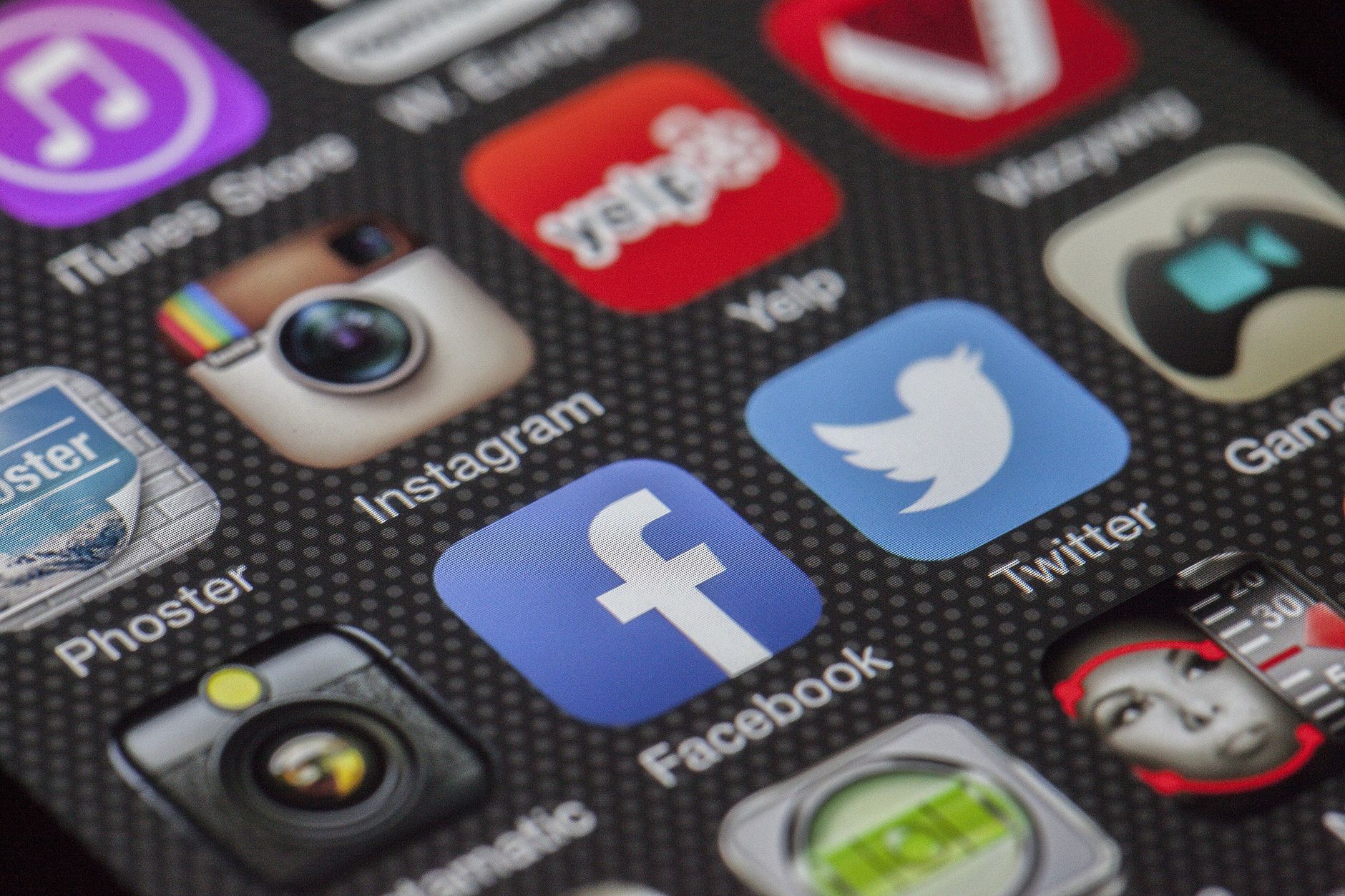Close-up image of various social media app icons on a smartphone screen. — Enterprise Application Management - Phases, Compon