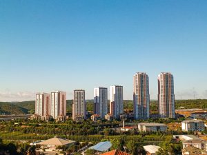 Aerial view of urban skyscrapers surrounded by greenery on a bright, clear day. — Fabulous Bonuses and Rewards at the Best On