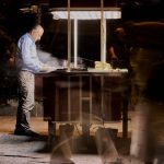 Street vendor cooking food at night with blurred people passing by. — NFLbite: Unrivalled Reddit NFL Streaming Platform