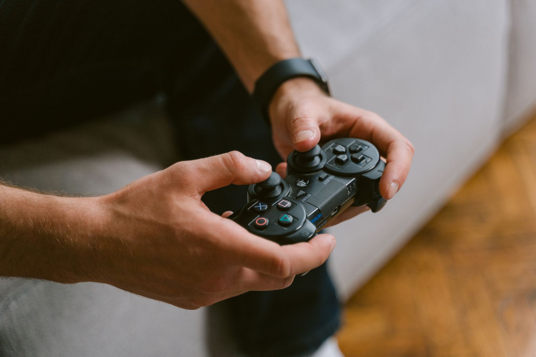 Hands holding a game controller while playing video games indoors, a leisure activity. — Get Maximum Fun Out of Your