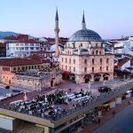 Aerial shot of Bolu city with a prominent mosque and bustling streets during twilight. — Tips And Strategy Guide To Conquer T