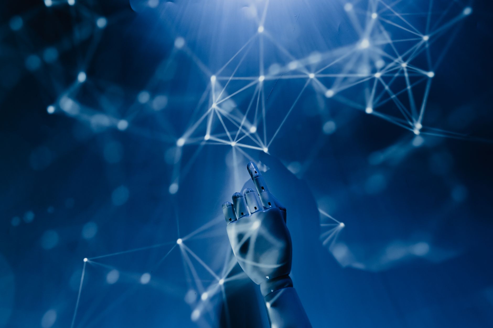 A robotic hand reaching into a digital network on a blue background, symbolizing AI technology. — Why Buying Windsor Farms ho