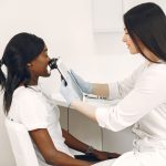 A specialist performing a skin analysis on a patient using advanced equipment in a clinic. — Why Hemi Pharma is the Best Choi